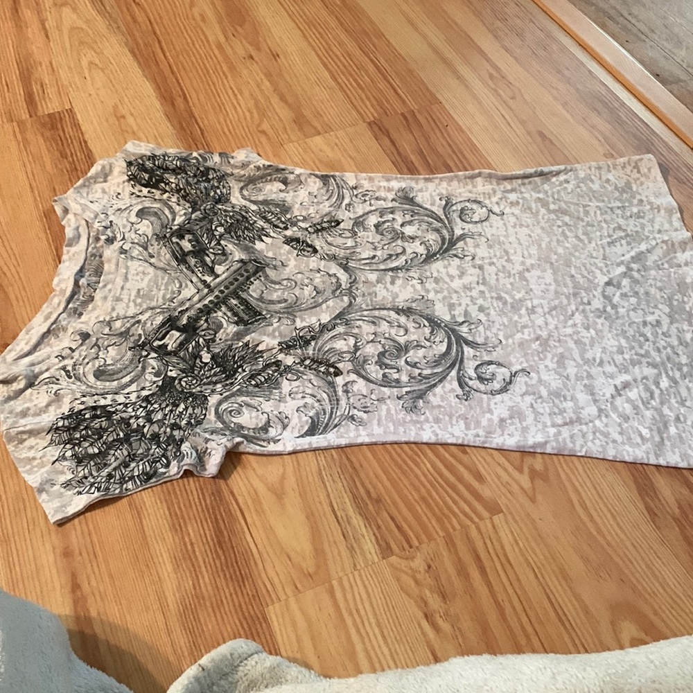 Buckle tshirt. White w see thru cutouts.